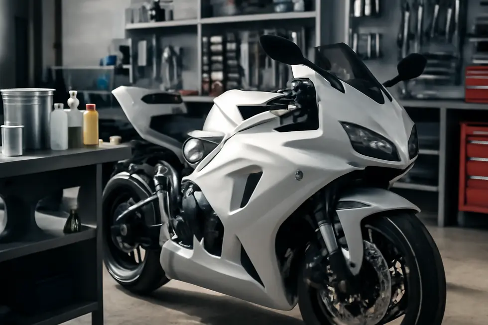 Glossy pearlescent motorcycle fairings on a bike inside a clean, professional motorcycle workshop with paint supplies.