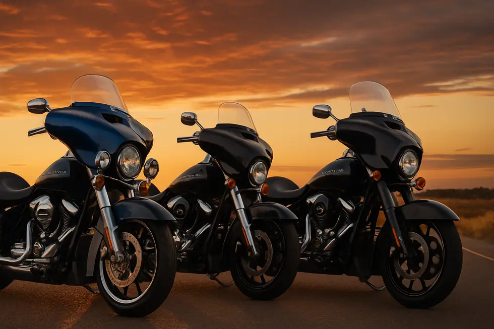 Multiple Harley-Davidson motorcycles with different aftermarket fairings and custom paint, parked together at sunset.